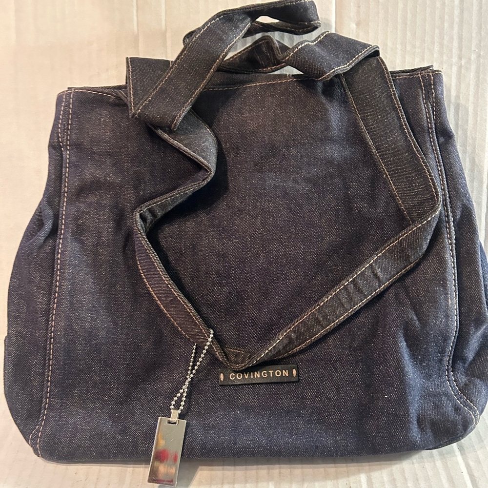 Woman’s blue Jean leopard print shoulder Covington bag